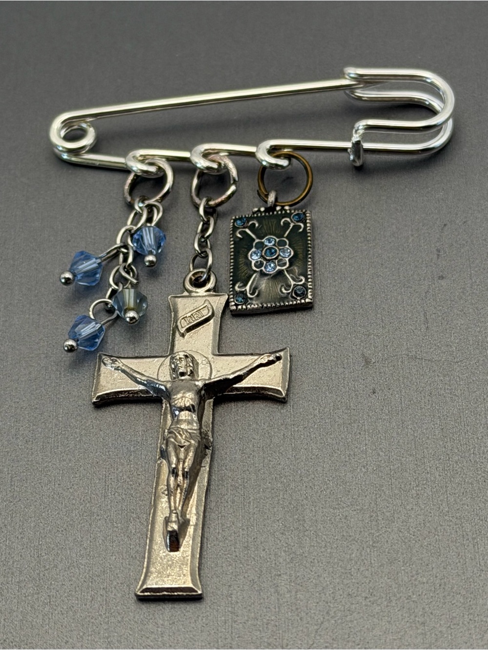 Silver-Tone Crucifix Safety Pin Brooch with Blue Accents